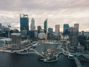 Aerial view of Elisabeth Quay at sunset with skyscrapers surrounding the harbour, Perth, Western Australia. - AAEF24020