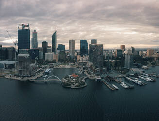 Aerial view of Elisabeth Quay at sunset with skyscrapers surrounding the harbour, Perth, Western Australia. - AAEF24021