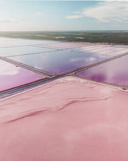 Panoramic aerial view of the pink salt lake Hutt Lagoon with areas of different colour of pink, red and purple, Port Gregory, Western Australia. - AAEF24034