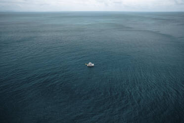 Aerial view of a boat in open water, Whitsundays, Australia. - AAEF24046