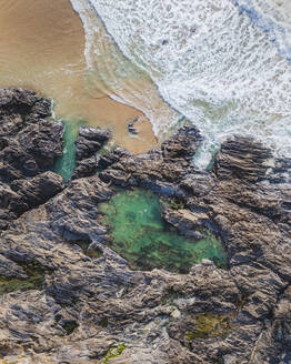 Aerial view of Treyarnon natural sea pool for cold water swimming, Treyarnon Bay, Cornwall, United Kingdom. - AAEF24059