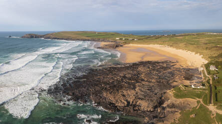 Panoramic aerial view of Constantine Bay and Boobies Bay during golden hour, Cornwall, United Kingdom. - AAEF24060