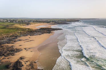 Aerial view of Constantine Bay and Boobies Bay during golden hour, Cornwall, United Kingdom. - AAEF24063