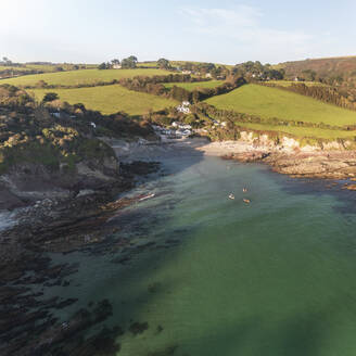 Aerial view of Talland Bay and countryside during golden hour, Cornwall, United Kingdom. - AAEF24066