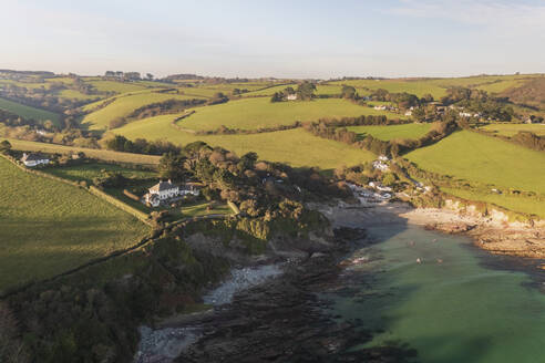 Aerial view of Talland Bay and countryside during golden hour, Cornwall, United Kingdom. - AAEF24067