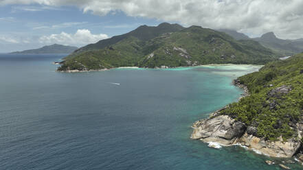 Arial view of the coastline and the Baie Ternay Marine National Park, Seychelles. - AAEF24077