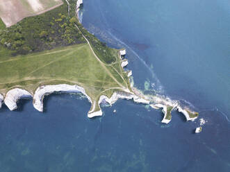 Aerial view of Iconic landmark of Old Harry Rocks and its white cliffs made of chalk in Studland, Dorset, United Kingdom. - AAEF24134