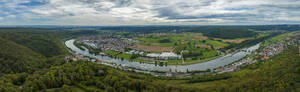 An aerial panoramic view of the river Neckar and the surrounding forests including the town of Neckarzimmern, Hassmersheim, Baden Wuerttemberg, Germany. - AAEF24139