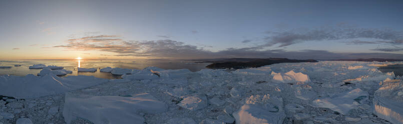 Aerial panoramic drone view of Ilulissat ice fjord at sunset, Greenland, Arctic. - AAEF24162