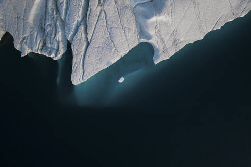 Aerial top-down drone view of an iceberg landscape structure at Ilulissat ice fjord, Greenland, Arctic. - AAEF24167