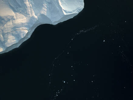 Aerial top-down drone view of an iceberg landscape structure at Ilulissat ice fjord, Greenland, Arctic. - AAEF24175