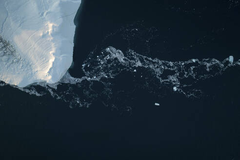 Aerial top-down drone view of an iceberg landscape structure at Ilulissat ice fjord, Greenland, Arctic. - AAEF24176