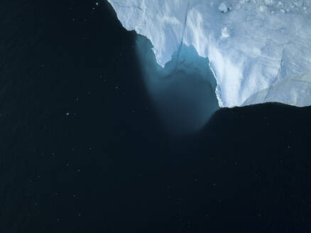 Aerial top-down drone view of an iceberg landscape structure at Ilulissat ice fjord, Greenland, Arctic. - AAEF24187