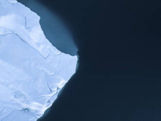 Aerial top-down drone view of an iceberg landscape structure at Ilulissat ice fjord, Greenland, Arctic. - AAEF24197