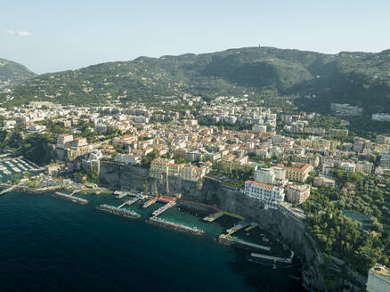 Aerial view of Sorrento, a small town along the coast facing the Mediterranean Sea near Naples, Campania, Italy. - AAEF24240