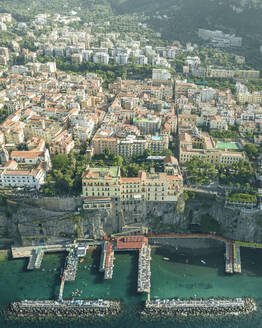 Aerial view of Sorrento, a small town along the coast facing the Mediterranean Sea near Naples, Campania, Italy. - AAEF24242