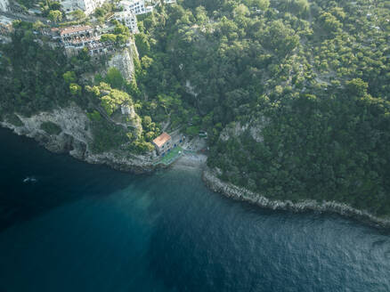 Aerial view of a small beach in a small bay along the coastline in Sorrento, Naples, Campania, Italy. - AAEF24254