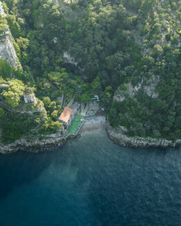 Aerial view of a small beach in a small bay along the coastline in Sorrento, Naples, Campania, Italy. - AAEF24255