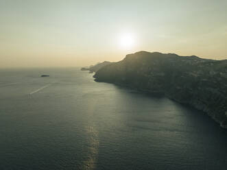 Aerial view of the Amalfi coast at sunset facing the Mediterranean Sea, Positano, Salerno, Campania, Italy. - AAEF24264