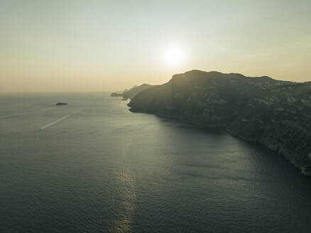 Aerial view of the Amalfi coast at sunset facing the Mediterranean Sea, Positano, Salerno, Campania, Italy. - AAEF24264