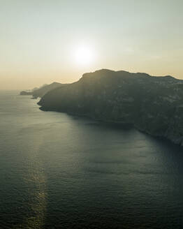 Aerial view of the Amalfi coast at sunset facing the Mediterranean Sea, Positano, Salerno, Campania, Italy. - AAEF24265