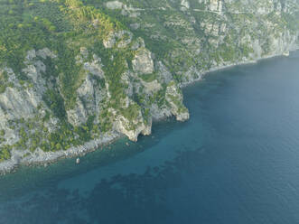 Aerial view of the Amalfi coast at sunset facing the Mediterranean Sea, Positano, Salerno, Campania, Italy. - AAEF24267