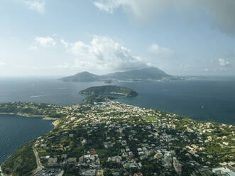 Aerial view of Procida Island with Ischia island in background, Flegree Islands archipelagos, Naples, Campania, Italy. - AAEF24378