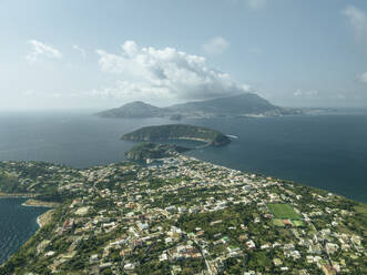 Aerial view of Procida Island with Ischia island in background, Flegree Islands archipelagos, Naples, Campania, Italy. - AAEF24384