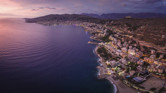 Aerial view of the coastal city of Saranda at sunset, Albania. - AAEF24425