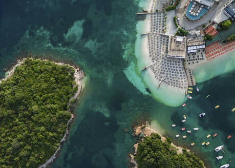 Aerial view of turquoise waters in Ksamil beach, Sarande, Albania. - AAEF24430