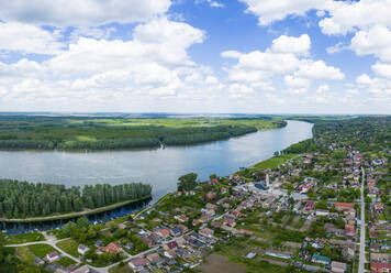 Aerial view of Aljmas small town along the Danube river dividing the border between Croatia and Serbia, Gornje Podunavlje Natural reserve, Osijek-Baranja, Croatia. - AAEF24513