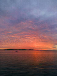 Aerial view of a dramatic sunset along the Adriatic sea coastline near Pula, Istria, Croatia. - AAEF24592