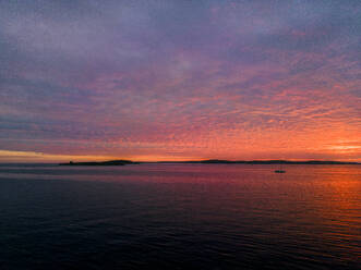 Aerial view of a dramatic sunset along the Adriatic sea coastline near Pula, Istria, Croatia. - AAEF24594