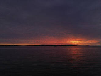 Aerial view of a dramatic sunset along the Adriatic sea coastline near Pula, Istria, Croatia. - AAEF24595