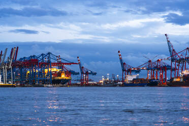 Germany, Hamburg, Container terminals Burchardkai and Eurogate in Port of Hamburg at dusk - IHF01846