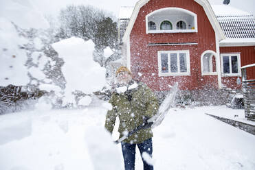 Man shoveling snow in winter - FOLF12340