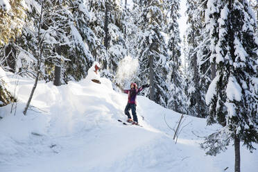 Girl playing with snow in forest - FOLF12355