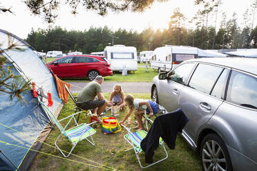 Family at camping ground during sunset - FOLF12383