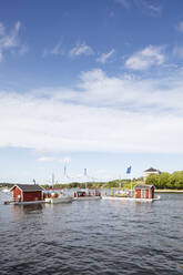 Floating cabins on sea under clouds - FOLF12417