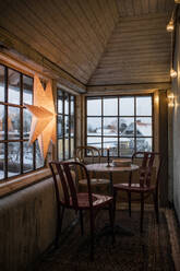 Table, chairs, and Christmas decorations in house - FOLF12448