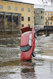 Upright red car in river, Norrkoping, Sweden - FOLF12514