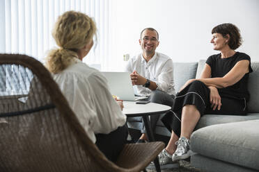 Colleagues talking during office meeting - FOLF12540