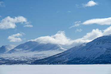 Snow on mountains under clouds in Sweden - FOLF12561