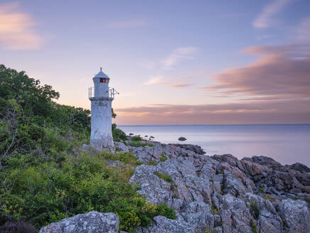 Lighthouse on rocks at sunset - FOLF12606