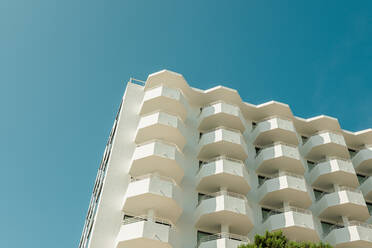 From below modern building under a blue sky on a sunny day - ADSF49148