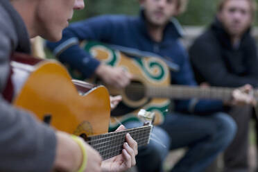 Men Playing Acoustic Guitars - FSIF06656