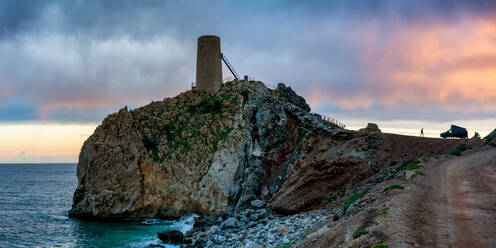 Panoramic view of the Torre del Pirulico, Spain under a sky with clouds at sunset - ADSF49244