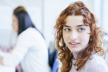 Redhead student with gray eyes in education training class - NJAF00638