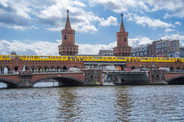 View of Oberbaum Bridge near Eastside section of the former Berlin Wall along the Spree River, Berlin, Germany, Europe - RHPLF28883