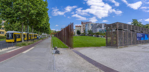 View of yellow city tram at the Berlin Wall Memorial, Memorial Park, Bernauer Strasse, Berlin, Germany, Europe - RHPLF28927